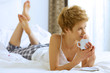 Woman drinking caffee in bed