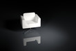 A white armchair on a black background