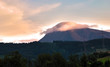cloud sitting on top of Slovak mountain, sunset