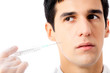 Man with syringe, isolated on white