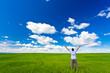 man on field rising up hands