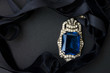 Pendant with black velvet ribbon on a dark background Pendant with black velvet ribbon on a dark background