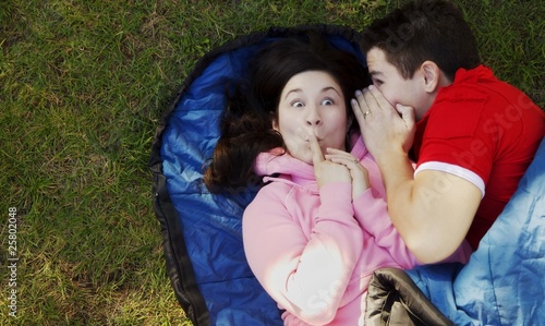 Photo: Couple Telling A Secret Couple Telling A Secret