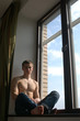 Sexy Muscular Man on the Window