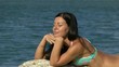 Beautiful young Woman Relaxing on the Beach Beautiful young Woman Relaxing on the Beach
