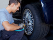 Tyre fitting with new alu rim on a suv