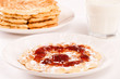 Waffle with jam and sugar. Milk