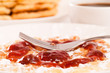 Closeup of waffle with jam and fork