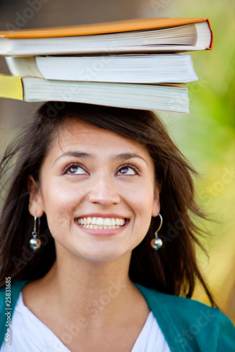 Photo: Student balancing books Student balancing books
