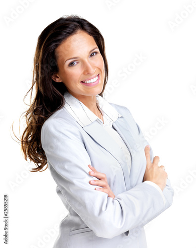 Photo: Confident young business lady standing with folded hand Confident young business lady standing with folded hand