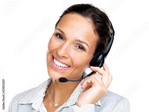Zdjęcie: Female customer representative with headset smiling during a tel Female customer representative with headset smiling during a tel
