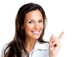 Happy young business woman pointing at copyspace