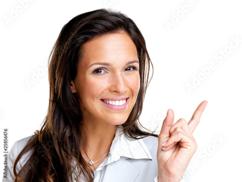 Foto: Happy young business woman pointing at copyspace Happy young business woman pointing at copyspace