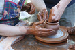 Potters hands creating a clay masterpiece Potters hands creating a clay masterpiece