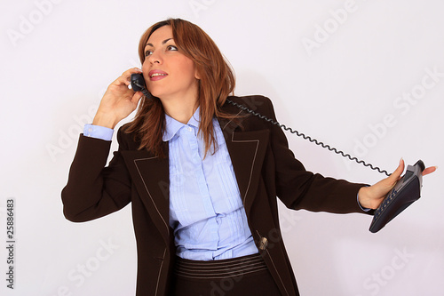 Photo: Attractive secretary speaking on the phone Attractive secretary speaking on the phone