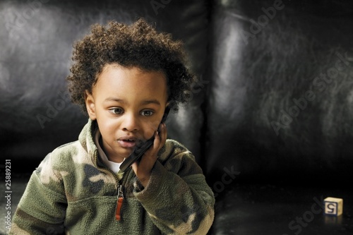 Photo: Child With Cell Phone Child With Cell Phone