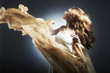 Portrait of the young woman against a flying fabric Portrait of the young woman against a flying fabric
