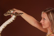 woman holding a snake woman holding a snake