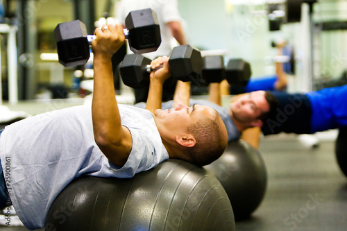 Photo: Men working out in gym Men working out in gym