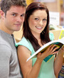Caucasian couple looking for a book Caucasian couple looking for a book