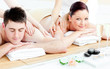 Attractive young couple enjoying a back massage Attractive young couple enjoying a back massage