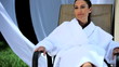 Sophisticated lady relaxing at a luxury health & beauty spa