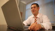 Successful businessman working on laptop in office Successful businessman working on laptop in office