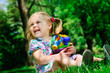 Pretty girl holding new toys for sandbox outdoor Pretty girl holding new toys for sandbox outdoor