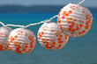 Colorful paper lamps on summer with a blue background Colorful paper lamps on summer with a blue background