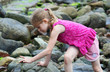 A Little Girl Finds Something Interesting on a Hike