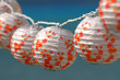 Party paper lamps on summer with a blue background Party paper lamps on summer with a blue background