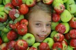Girls head in apples mass