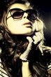 Fashion portrait of a l young sexy woman wearing sunglasses Fashion portrait of a l young sexy woman wearing sunglasses