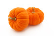 Orange Gourds Stacked Over White