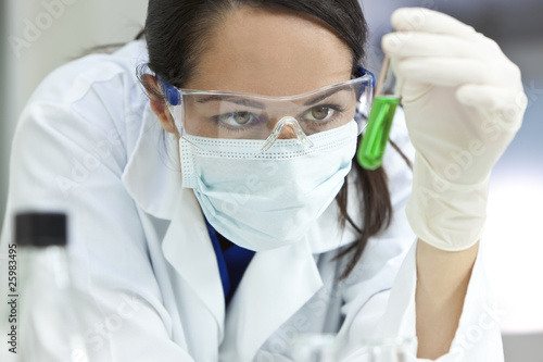 Photo: Female Laboratory Scientist or Doctor & Green Liquid Test Tube Female Laboratory Scientist or Doctor & Green Liquid Test Tube