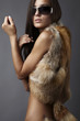 stylish brunette in fox cape and sun glasses.