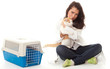 Photo: young woman vet stroking cat, transporter in background. young woman vet stroking cat, transporter in background.