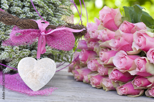 Photo: Beautiful roses with pink bow and white heather Beautiful roses with pink bow and white heather