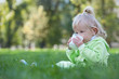 Serious little girl drinking milk