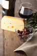 Olives, cheese, and red wine