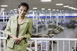 Portrait of businesswoman on balcony in warehouse