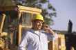 Hispanic male contractor talking on cell phone