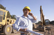 Hispanic male contractor talking on cell phone