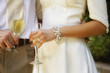 Bride and groom holding champagne flutes