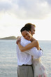 Couple hugging at beach