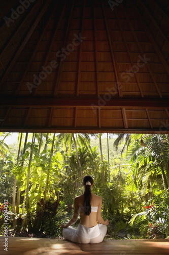 Photo: Pacific Islander woman meditating in jungle Pacific Islander woman meditating in jungle