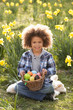 Boy On Easter Egg Hunt In Daffodil Field Boy On Easter Egg Hunt In Daffodil Field