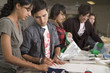 Fashion design students working on sketches in classroom