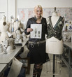 Mixed race fashion design woman showcasing design