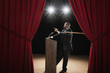 African American man being pulled offstage with cane